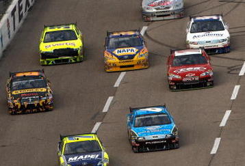 FORT WORTH, TX - NOVEMBER 08:  Regan Smith, driver of the #78 Furniture Row Chevrolet, leads a group of cars during the NASCAR Sprint Cup Series Dickies 500 at Texas Motor Speedway on November 8, 2009 in Fort Worth, Texas.  (Photo by Chris Graythen/Getty Images)
