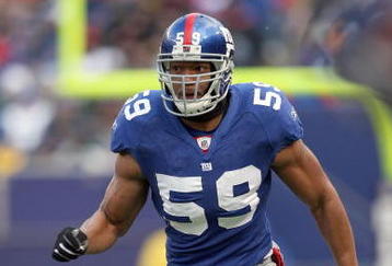 EAST RUTHERFORD, NJ - DECEMBER 7:  Gerris Wilkinson #59 of the New York Giants runs on the field against the Philadelphia Eagles at Giants Stadium on December 7, 2008 in East Rutherford, New Jersey. (Photo by Nick Laham/Getty Images)