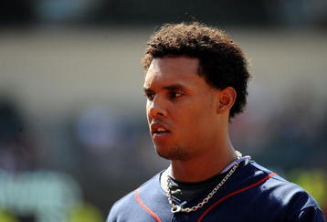 ANAHEIM, CA - JULY 26:  Carlos Gomez #22 of the Minnesota Twins returns to the dugout against the Los Angeles Angels of Anaheim at Angels Stadium on July 26, 2009 in Anaheim, California.  (Photo by Harry How/Getty Images)