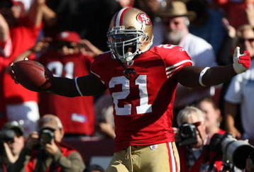SAN FRANCISCO - NOVEMBER 08: Frank Gore #21 of the San Francisco 49ers celebrates after scoring a touchdown against the Tennessee Titans during an NFL game on November 8, 2009 at Candlestick Park in San Francisco, California.  (Photo by Jed Jacobsohn/Getty Images)
