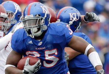 LAWRENCE, KS - OCTOBER 10:  Toben Opurum #35 of the Kansas Jayhawks runs with the ball during the game against the Iowa State Cyclones on October 10, 2009 at Memorial Stadium in Lawrence, Kansas. (Photo by Jamie Squire/Getty Images)