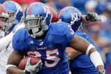LAWRENCE, KS - OCTOBER 10:  Toben Opurum #35 of the Kansas Jayhawks runs with the ball during the game against the Iowa State Cyclones on October 10, 2009 at Memorial Stadium in Lawrence, Kansas. (Photo by Jamie Squire/Getty Images)