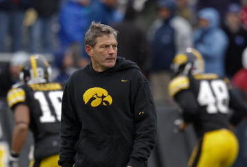IOWA CITY, IOWA - NOVEMBER 8: Head Coach Kirk Ferentz of the Iowa Hawkeyes runs his team through pre-game drills before taking on the  Penn State Nittany Lions at Kinnick Stadium on November 8, 2008 in Iowa City, Iowa. Iowa defeated Penn State  24-23. (Photo by David Purdy/Getty Images)