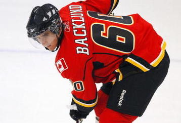 MISSISSAUGA, CANADA - AUGUST 26:  Mikael Backlund #60 of the Calgary Flames gets set for a face-off during the Upper Deck NHL Rookie Debut at the Hershey Centre August 26, 2009 in Mississauga, Ontario, Canada.  (Photo By Dave Sandford/Getty Images)
