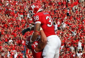PISCATAWAY, NJ - SEPTEMBER 07:  Joe Martinek #38 of the Rutgers Scarlet Knights celebrates his touchdown against the Cincinnati Bearcats with teammate Howard Barbieri #74 at Rutgers Stadium on September 7, 2009 in Piscataway, New Jersey.  (Photo by Jim McIsaac/Getty Images)