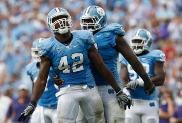 CHAPEL HILL, NC - SEPTEMBER 19:  Robert Quinn #42 of the North Carolina Tar Heels celebrates after a sack with teammate Marvin Austin #9 against the East Carolina Pirates at Kenan Stadium on September 19, 2009 in Chapel Hill, North Carolina.  (Photo by Streeter Lecka/Getty Images)