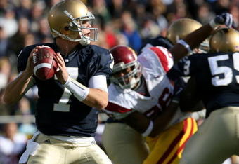 SOUTH BEND, IN - OCTOBER 17: Quarterback Jimmy Clausen #7 of the Notre Dame Fighting Irish looks to pass the ball against the USC Trojans in the first quarter of the game at Notre Dame Stadium on October 17, 2009 in South Bend, Indiana. (Photo by Jonathan Daniel/Getty Images)
