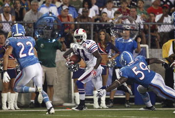 CANTON, OH - AUGUST 9: Roscoe Parrish #11 of the Buffalo Bills looks for running room after catching a pass against the Tennessee Titans during the Pro Football Hall of Fame Game at Fawcett Stadium on August 9, 2009 in Canton, Ohio. The Titans defeated the Bills 21-18. (Photo by Joe Robbins/Getty Images)