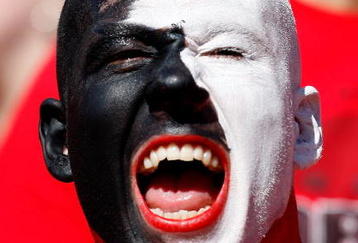 ATHENS, GA - OCTOBER 03:  A fan of the Georgia Bulldogs cheers against the Louisiana State University Tigers at Sanford Stadium on October 3, 2009 in Athens, Georgia.  (Photo by Kevin C. Cox/Getty Images)