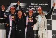 ABU DHABI, UNITED ARAB EMIRATES - NOVEMBER 01: (L-R) Second placed Mark Webber of Australia and Red Bull Racing, Red Bull Racing Team Principal Christian Horner, race winner Sebastian Vettel of Germany and Red Bull Racing and third placed Jenson Button of Great Britain and Brawn GP celebrate on the podium following the Abu Dhabi Formula One Grand Prix at the Yas Marina Circuit on November 1, 2009 in Abu Dhabi, United Arab Emirates. (Photo by Mark Thompson/Getty Images)