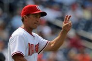 WASHINGTON - AUGUST 06:  Manager Jim Riggleman #5 of the Washington Nationals heads to the mound and motions for the left hander from the bullpen to face the Florida Marlins at Nationals Park on August 6, 2009 in Washington, DC. The Nationals defeated the Marlins 12-8.  (Photo by Doug Pensinger/Getty Images)