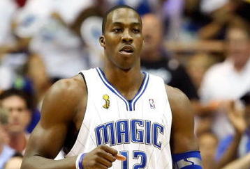 ORLANDO, FL - JUNE 14:  Dwight Howard #12 of the Orlando Magic reacts in the first quarter of Game Five of the 2009 NBA Finals against the Los Angeles Lakers on June 14, 2009 at Amway Arena in Orlando, Florida.  NOTE TO USER:  User expressly acknowledges and agrees that, by downloading and or using this photograph, User is consenting to the terms and conditions of the Getty Images License Agreement.  (Photo by Ronald Martinez/Getty Images)
