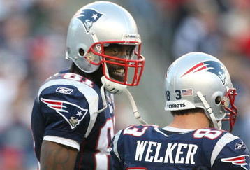 FOXBORO, MA - NOVEMBER 8:  Randy Moss #81 of the New England Patriots reacts with teammate Wes Welker #83 during a game against the Miami Dolphins at Gillette Stadium on November 8, 2009 in Foxboro, Massachusetts. The Patriots won 27-17. (Photo by Jim Rogash/Getty Images)