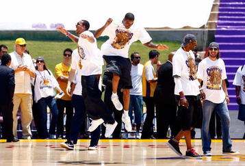 LOS ANGELES, CA - JUNE 17:  (L-R) Shannon Brown, Trevor Ariza, DJ Mbenga and Sasha Vujacic of the Los Angeles Lakers celebrate on stage during the 2009 NBA Championship Victory Parade at the Los Angeles Memorial Coliseum on June 17, 2009 in Los Angeles, California.  (Photo by Jeff Gross/Getty Images)