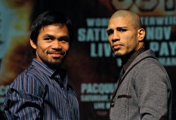 LAS VEGAS - NOVEMBER 11:  Boxer Manny Pacquiao (L) and WBO welterweight champion Miguel Cotto pose during the final news conference for their bout at the MGM Grand Hotel/Casino November 11, 2009 in Las Vegas, Nevada. Pacquiao and Cotto will meet in a WBO welterweight title fight at the MGM Grand on November 14.  (Photo by Ethan Miller/Getty Images)