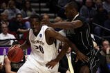PORTLAND, OR - MARCH 21:  Quincy Pondexter #20 of the Washington Huskies drives on Keaton Grant #5 of the Purdue Boilermakers in the first half during the second round of the NCAA Division I Men's Basketball Tournament at the Rose Garden on March 21, 2009 in Portland, Oregon.  (Photo by Jonathan Ferrey/Getty Images)