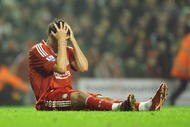 LIVERPOOL, ENGLAND - NOVEMBER 09: Albert Riera of Liverpool reacts after sustaining an injury during the Barclays Premier League match between Liverpool and Birmingham City at Anfield on November 9, 2009 in Liverpool, England. (Photo by Laurence Griffiths/Getty Images)
