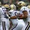 SOUTH BEND, IN - OCTOBER 03: Chris Polk #1 of the Washington Huskies follows blocker Senio Kelemete #56 against the Notre Dame Fighting Irish on October 3, 2009 at Notre Dame Stadium in South Bend, Indiana. Notre Dame defeated Washington 37-30 in overtime. (Photo by Jonathan Daniel/Getty Images)