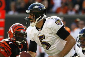 CINCINNATI - NOVEMBER 8: Quarterback Joe Flacco #5 of the Baltimore Ravens scrambles under pressure from Frank Walker #41 of the Cincinnati Bengals in their NFL game at Paul Brown Stadium November 8, 2009 in Cincinnati, Ohio.    (Photo by John Sommers II/Getty Images)