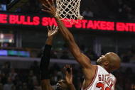 CHICAGO - NOVEMBER 03: Taj Gibson #22 of the Chicago Bulls leaps to block a shot by Hakim Warrick #21 of the Milwaukee Bucks at the United Center on November 3, 2009 in Chicago, Illinois. The Bulls defeated the Bucks 83-81. (Photo by Jonathan Daniel/Getty Images)