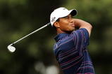 MELBOURNE, AUSTRALIA - NOVEMBER 12:  Tiger Woods of the USA plays an approach shot on the 18th hole during round one of the 2009 Australian Masters at Kingston Heath Golf Club on November 12, 2009 in Melbourne, Australia.  (Photo by Mark Dadswell/Getty Images)