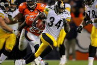 DENVER - NOVEMBER 09:  Rashard Mendenhall #34 of the Pittsburgh Steelers rushes 34 yards for a first down against the Denver Broncos in the fourth quarter during NFL action at Invesco Field at Mile High on November 9, 2009 in Denver, Colorado. The Steelers defeated the Broncos 28-10.  (Photo by Doug Pensinger/Getty Images)