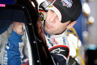 MARTINSVILLE, VA - OCTOBER 23:  Jimmie Johnson gets in the #48 Lowe's Chevrolet in the garage prior to practice for the NASCAR Sprint Cup Series TUMS Fast Relief 500 at Martinsville Speedway on October 23, 2009 in Martinsville, Virginia.  (Photo by Streeter Lecka/Getty Images)