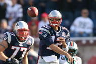 FOXBORO, MA - NOVEMBER 8:  Tom Brady #12 of the New England Patriots throws against the Miami Dolphins at Gillette Stadium on November 8, 2009 in Foxboro, Massachusetts.  (Photo by Jim Rogash/Getty Images)