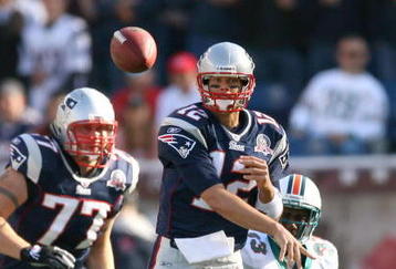 FOXBORO, MA - NOVEMBER 8:  Tom Brady #12 of the New England Patriots throws against the Miami Dolphins at Gillette Stadium on November 8, 2009 in Foxboro, Massachusetts.  (Photo by Jim Rogash/Getty Images)