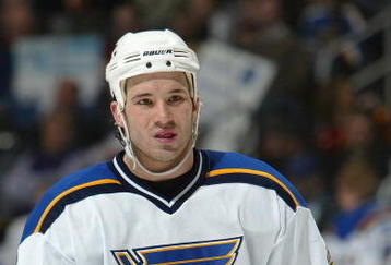 ALTANTA - JANUARY 28:  Forward Mike Danton #22 of the St. Louis Blues stands on the ice during the game against the Atlanta Thrashers at the Philips Arena on January 28, 2004 in Atlanta, Georgia.  (Photo by Jamie Squire/Getty Images)