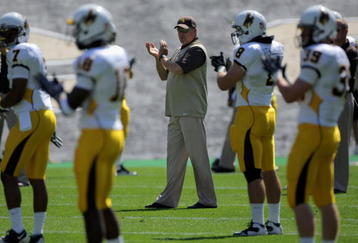 BOULDER, CO - SEPTEMBER 19:  Head coach Dave Christensen of the Wyoming Cowboys prepares to lead his team against the Colorado Buffaloes at Folsom Field on September 19, 2009 in Boulder, Colorado. The Buffaloes defeated the Cowboys 24-0.  (Photo by Doug Pensinger/Getty Images)