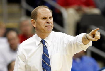 KANSAS CITY, MO - MARCH 19:  Head Coach John Beilein of the Michigan Wolverines points toward the court from the sideline during their first round game against the Clemson Tigers in the NCAA Division I Men's Basketball Tournament at the Sprint Center on March 19, 2009 in Kansas City, Missouri.  The Wolverines defeated the Tigers 62-59.  (Photo by Jamie Squire/Getty Images)