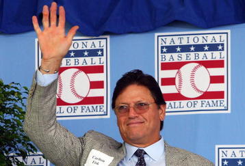 COOPERSTOWN, NY - JULY 26:  Hall of Famer Carlton Fisk waves to the crowd as he is introduced at Clark Sports Center during the 2009  Baseball Hall of Fame induction ceremony on July 26, 2009 in Cooperstown, New York.  (Photo by Jim McIsaac/Getty Images)