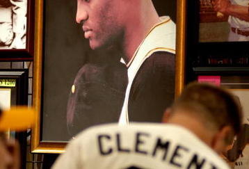 PITTSBURGH - JULY 7: Fans look over Roberto Clemente memorabilia during opening day of Fan Fest for the Major League Baseball 2006 All-Star game at the David L. Lawrence Convention Center July 7, 2006 in Pittsburgh, Pennsylvania. (Photo by Paul Hawthorne/Getty Images)