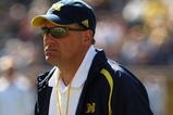 ANN ARBOR, MI - SEPTEMBER 19:  Head coach Rich Rodriguez of the Michigan Wolverines watches warmups before the game with the Eastern Michigan Eagles at Michigan Stadium on September 19, 2009 in Ann Arbor, Michigan.  Michigan won 45-17.  (Photo by Stephen Dunn/Getty Images)