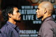 LAS VEGAS - NOVEMBER 11:  Boxer Manny Pacquiao (L) and WBO welterweight champion Miguel Cotto pose during the final news conference for their bout at the MGM Grand Hotel/Casino November 11, 2009 in Las Vegas, Nevada. Pacquiao and Cotto will meet in a WBO welterweight title fight at the MGM Grand on November 14.  (Photo by Ethan Miller/Getty Images)