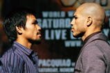 LAS VEGAS - NOVEMBER 11:  Boxer Manny Pacquiao (L) and WBO welterweight champion Miguel Cotto pose during the final news conference for their bout at the MGM Grand Hotel/Casino November 11, 2009 in Las Vegas, Nevada. Pacquiao and Cotto will meet in a WBO welterweight title fight at the MGM Grand on November 14.  (Photo by Ethan Miller/Getty Images)