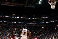 MIAMI - OCTOBER 28:  Dwyane Wade #3 of the Miami Heat watches as his team shoots free-throws on the other end of the court against the New York Knicks at AmericanAirlines Arena on October 28, 2009 in Miami, Florida. The Heat defeated the Knicks 115-93. NOTE TO USER: User expressly acknowledges and agrees that, by downloading and/or using this Photograph, user is consenting to the terms and conditions of the Getty Images License Agreement.  (Photo by Doug Benc/Getty Images)