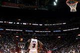 MIAMI - OCTOBER 28:  Dwyane Wade #3 of the Miami Heat watches as his team shoots free-throws on the other end of the court against the New York Knicks at AmericanAirlines Arena on October 28, 2009 in Miami, Florida. The Heat defeated the Knicks 115-93. NOTE TO USER: User expressly acknowledges and agrees that, by downloading and/or using this Photograph, user is consenting to the terms and conditions of the Getty Images License Agreement.  (Photo by Doug Benc/Getty Images)