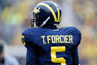 ANN ARBOR, MI - OCTOBER 24: Tate Forcier #5 of the Michigan Wolverines looks on during the game against the Penn State Nittany Lions on October 24, 2009 at Michigan Stadium in Ann Arbor, Michigan. (Photo by Gregory Shamus/Getty Images)