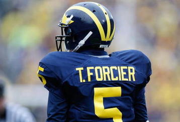 ANN ARBOR, MI - OCTOBER 24:  Tate Forcier #5 of the Michigan Wolverines looks on during the game against the Penn State Nittany Lions on October 24, 2009 at Michigan Stadium in Ann Arbor, Michigan. (Photo by  Gregory Shamus/Getty Images)