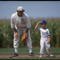 DYERSVILLE, IA - AUGUST 25: A 'ghost player' recreating the role of Chicago White Sox legend Shoeless Joe Jackson plays ball with a young tourist at the baseball field created for the motion picture 'Field of Dreams' on August 25, 1991 in Dyersville, Iowa. Rita and Al Ameskamp who, with Don and Becky Lansing, co-own the site have turned the cornfields and baseball diamond into a summertime tourist attraction, including 'ghost player' reenactments. (Photo by Jonathan Daniel/Getty Images)