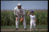 DYERSVILLE, IA - AUGUST 25: A 'ghost player' recreating the role of Chicago White Sox legend Shoeless Joe Jackson plays ball with a young tourist at the baseball field created for the motion picture 'Field of Dreams' on August 25, 1991 in Dyersville, Iowa. Rita and Al Ameskamp who, with Don and Becky Lansing, co-own the site have turned the cornfields and baseball diamond into a summertime tourist attraction, including 'ghost player' reenactments. (Photo by Jonathan Daniel/Getty Images)