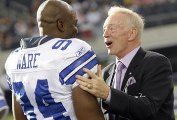 ARLINGTON, TX - AUGUST 21:  Dallas Cowboys team owner Jerry Jones talks with linebacker DeMarcus Ware #94 prior to the Cowboys taking the field against the Tennessee Titans during a preseason game at Cowboys Stadium on August 21, 2009 in Arlington, Texas. (Photo by Tom Pennington/Getty Images)
