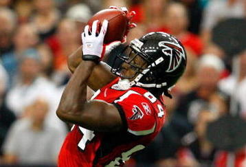 ATLANTA - SEPTEMBER 13:  Roddy White #84 of the Atlanta Falcons pulls in this reception against Christopher Owens #21 of the Miami Dolphins at Georgia Dome on September 13, 2009 in Atlanta, Georgia.  (Photo by Kevin C. Cox/Getty Images)