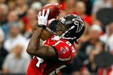 ATLANTA - SEPTEMBER 13:  Roddy White #84 of the Atlanta Falcons pulls in this reception against Christopher Owens #21 of the Miami Dolphins at Georgia Dome on September 13, 2009 in Atlanta, Georgia.  (Photo by Kevin C. Cox/Getty Images)