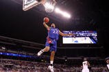 INDIANAPOLIS - MARCH 27:  Marcus Morris #22 of the Kansas Jayhawks drives for a dunk attempt against the Michigan State Spartans during the third round of the NCAA Division I Men's Basketball Tournament at the Lucas Oil Stadium on March 27, 2009 in Indianapolis, Indiana.  (Photo by Andy Lyons/Getty Images)