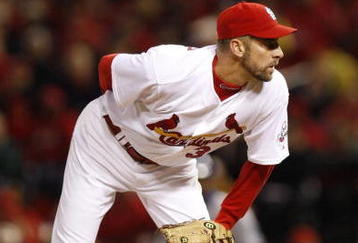 ST. LOUIS, MO - OCTOBER 10:   Pitcher John Smoltz #30 of the St. Louis Cardinals delivers a pitch against the Los Angeles Dodgers in the seventh inning of Game Three of the NLDS during the 2009 MLB Playoffs at Busch Stadium on October 10, 2009 in St. Louis, Missouri. (Photo by Ronald Martinez/Getty Images) )