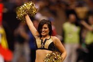 NEW ORLEANS - NOVEMBER 02:  New Orleans Saintsations cheerleaders dance during the game between the New Orleans Saints and the Atlanta Falcons at Louisana Superdome on November 2, 2009 in New Orleans, Louisiana.  (Photo by Chris Graythen/Getty Images)