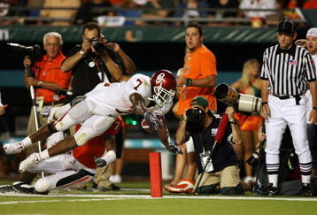 FORT LAUDERDALE, FL - OCTOBER 03: Running back DeMarco Murray #7 of the Oklahoma Sooners dives for the end-zone but comes up short as he is taken out of bounds by defensive back Vaughn Telemaque #7 of the Miami Hurricanes at Land Shark Stadium on October 3, 2009 in Fort Lauderdale, Florida. Miami defeated Oklahoma 21-20. (Photo by Doug Benc/Getty Images)